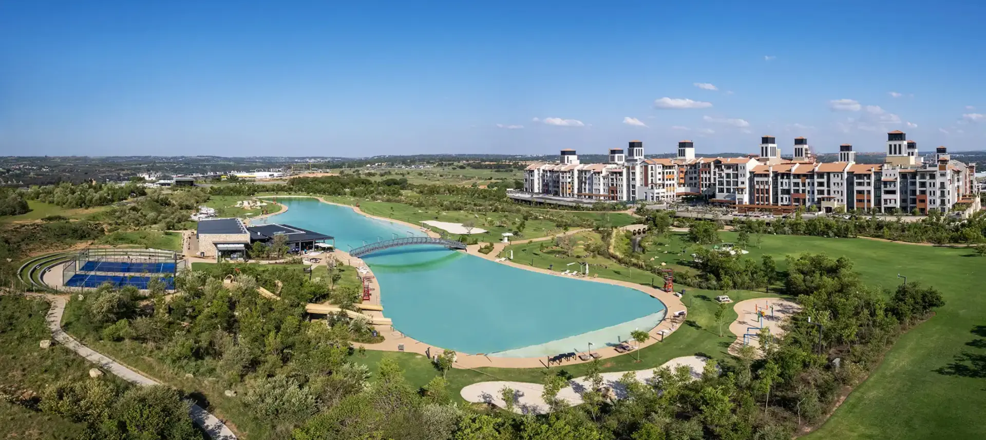 Aerial view of the City Centre apartments and lagoon parkland at Steyn City
