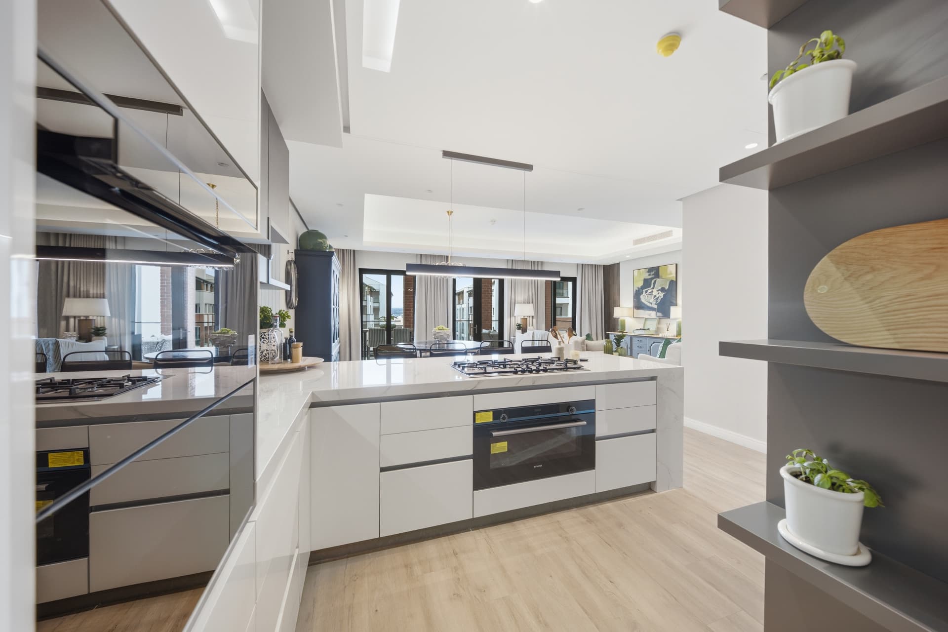 Kitchen with an island, gas hob and built-in oven